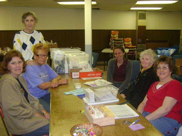 Linda, Sharry, Peggy, Julia, Marian, and Donna serve in registration.